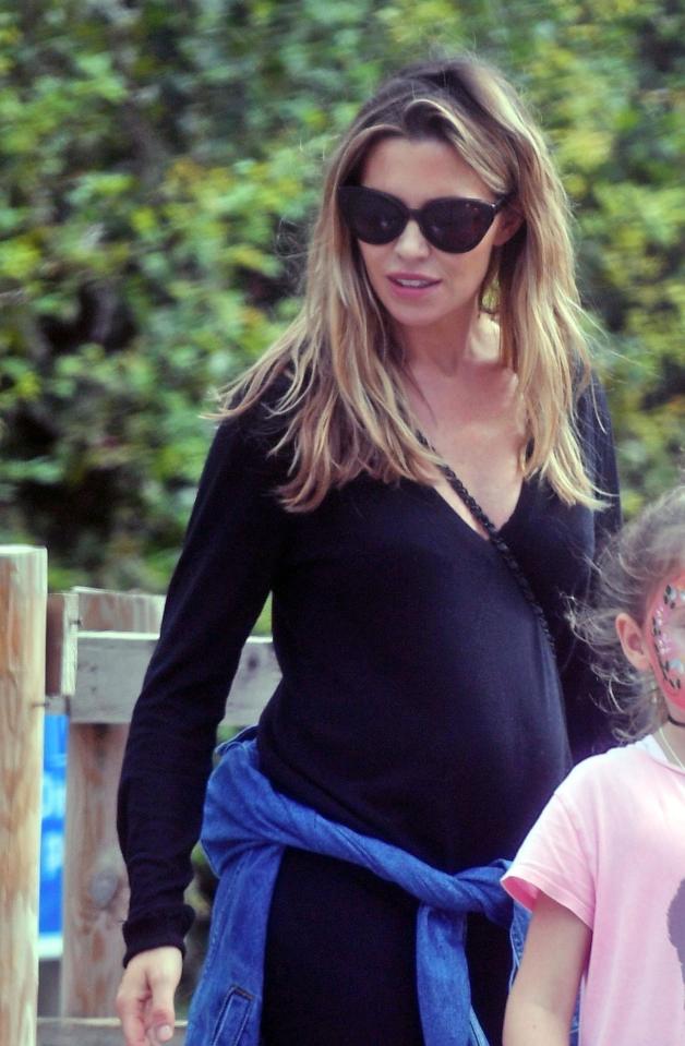  Abbey Clancy glows as she spends a day with her kids