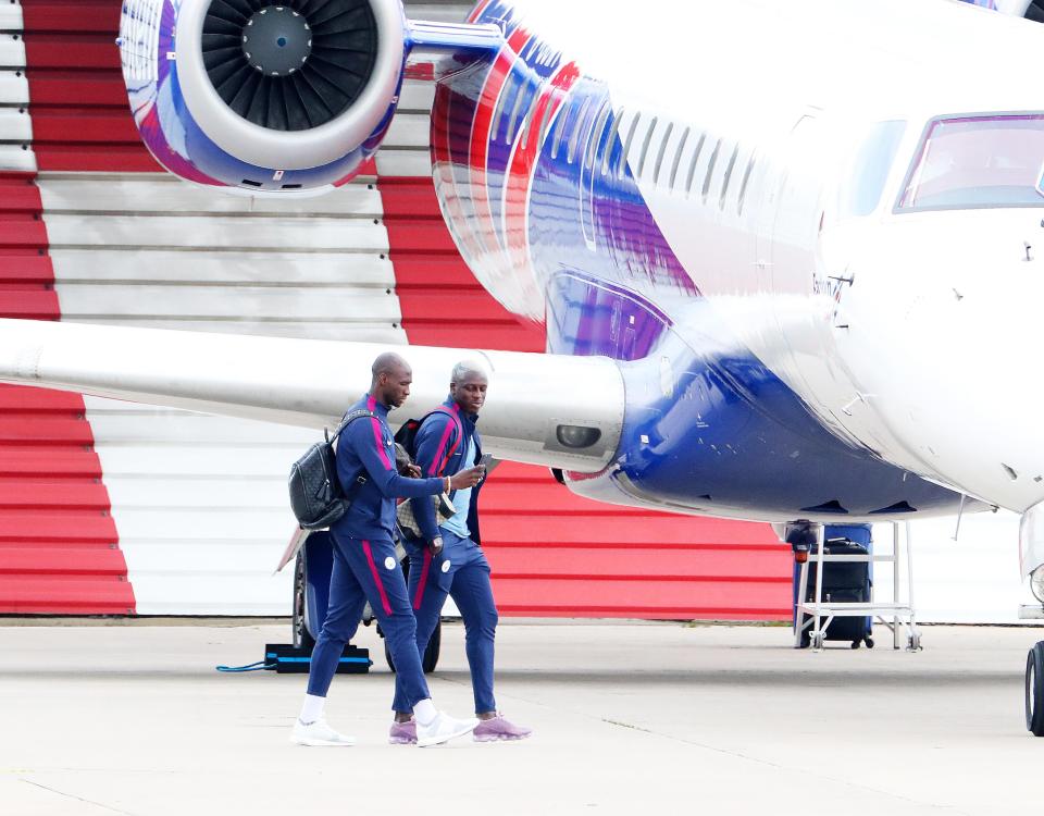 New boy Benjamin Mendy and Eliaquim Mangala take a selfie before they get on the plane