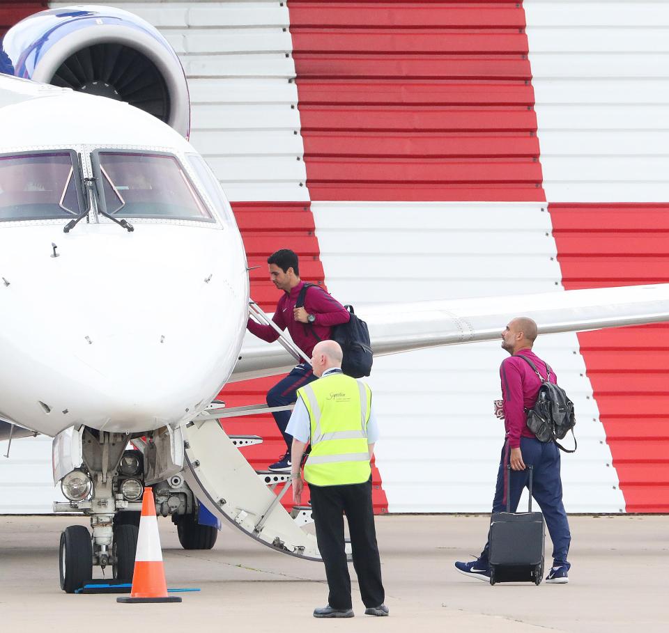 Guardiola and his squad pile onto the plane 