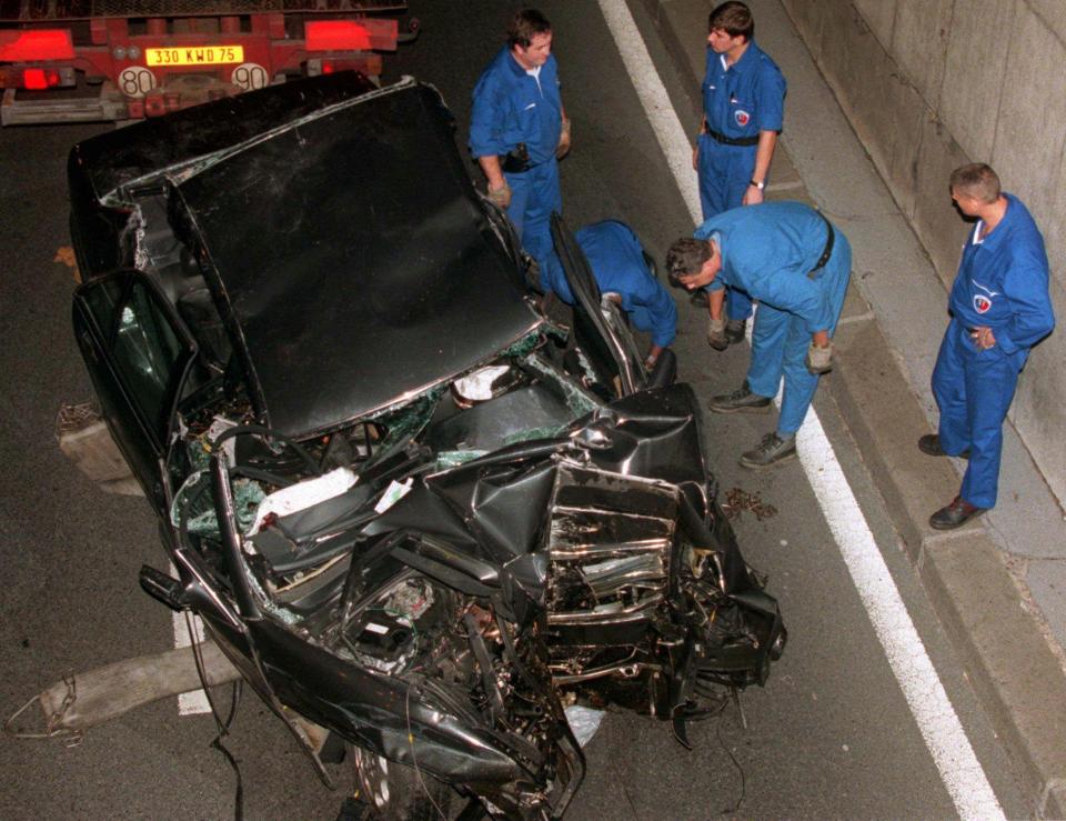  Police services prepare to take the limo in which Princess Diana died