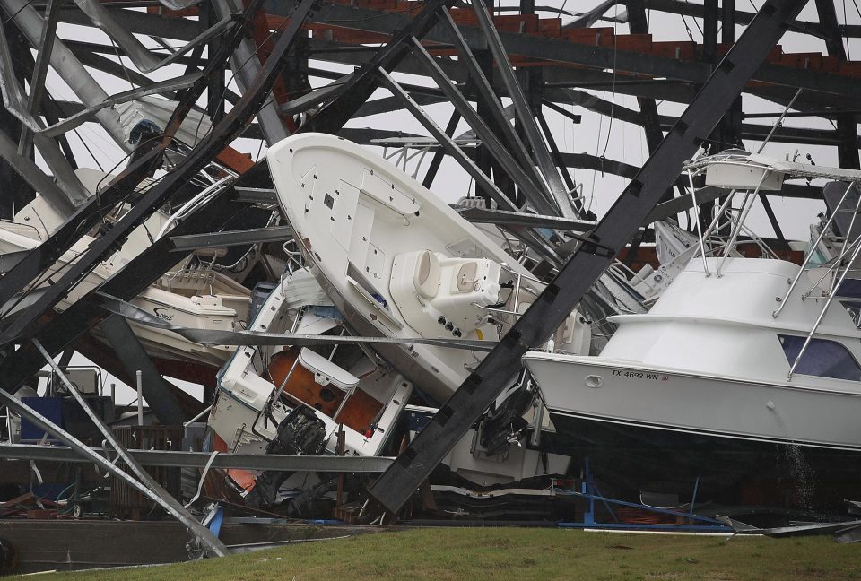  Toppled boats hang in the debris of a boat storage facility that was damaged by Hurricane Harvey