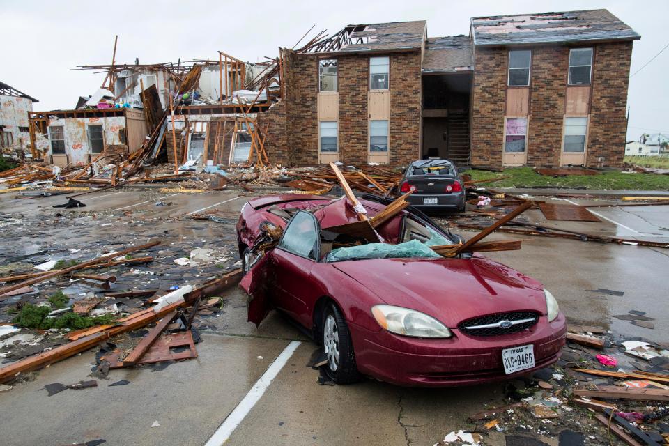  A damaged car sits outside a heavily damaged apartment complex in Rockport, Texas, after Hurricane Harvey struck the area