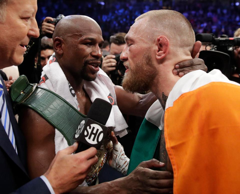 Floyd Mayweather and Conor McGregor embrace after their Las Vegas showdown