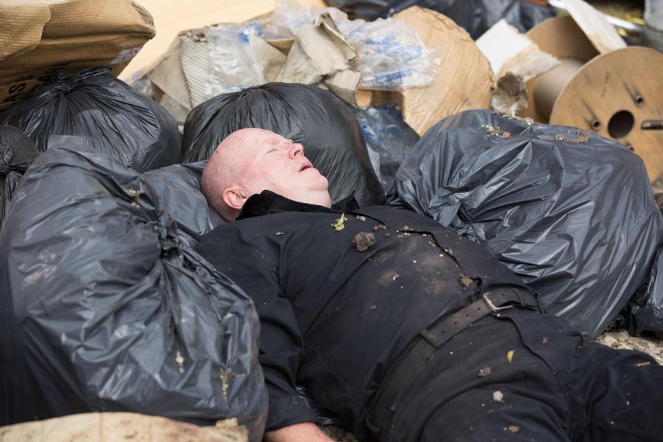  This exclusive photo shows Phil Mitchell unconscious, covered in rubble and dirt, in the aftermath of the gas explosion