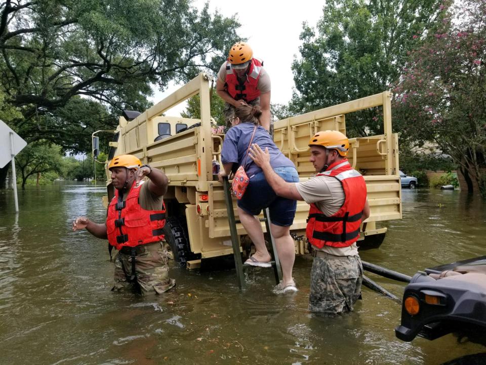  Emergency crews raced to pull people from cars and homes as the hurricane caused chest-deep flooding on some streets in Houston