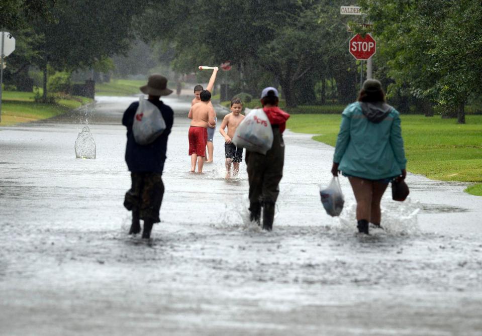  Emergency crews raced to pull people from cars and homes as the Category Four hurricane caused chest-deep flooding on some streets in Houston