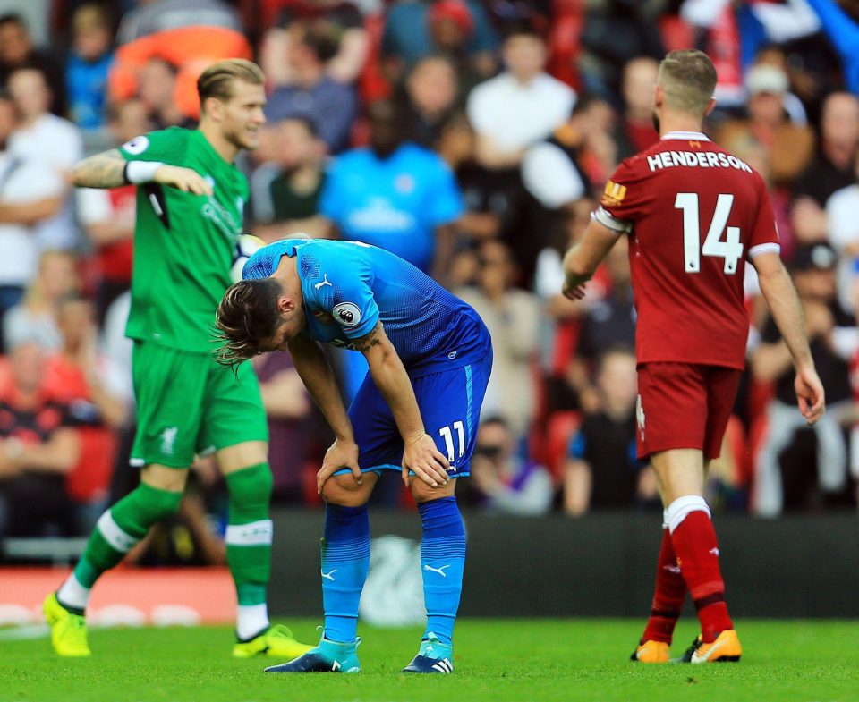 Mesut Ozil seems gutted after the 4-0 loss but his long-term Arsenal future is in doubt 