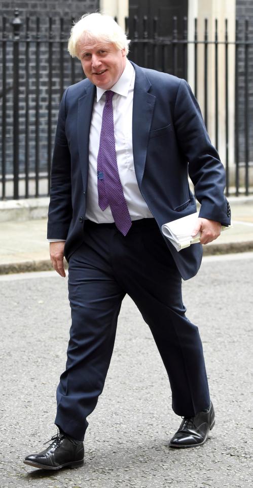  The Foreign Secretary carrying the notes outside No10