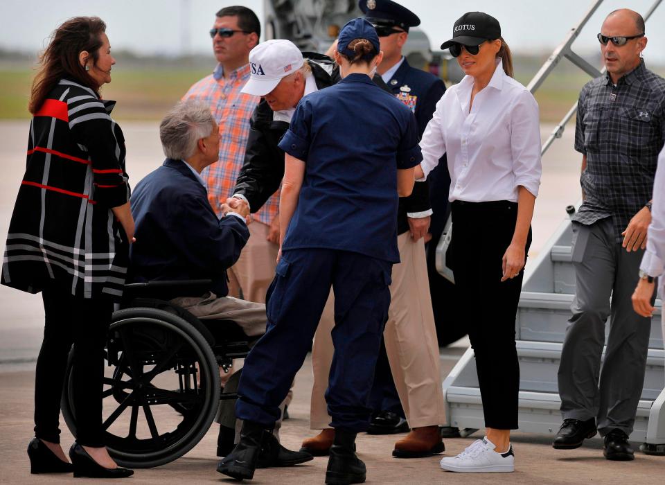  Melania wore a sports jacket, baseball cap and her sneakers as she stepped off Air Force One