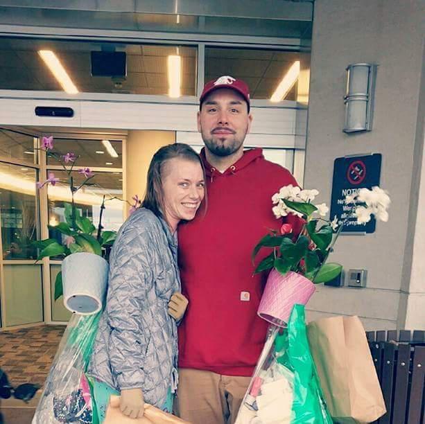  Angel, pictured with her partner Aaron, was discharged from hospital in December