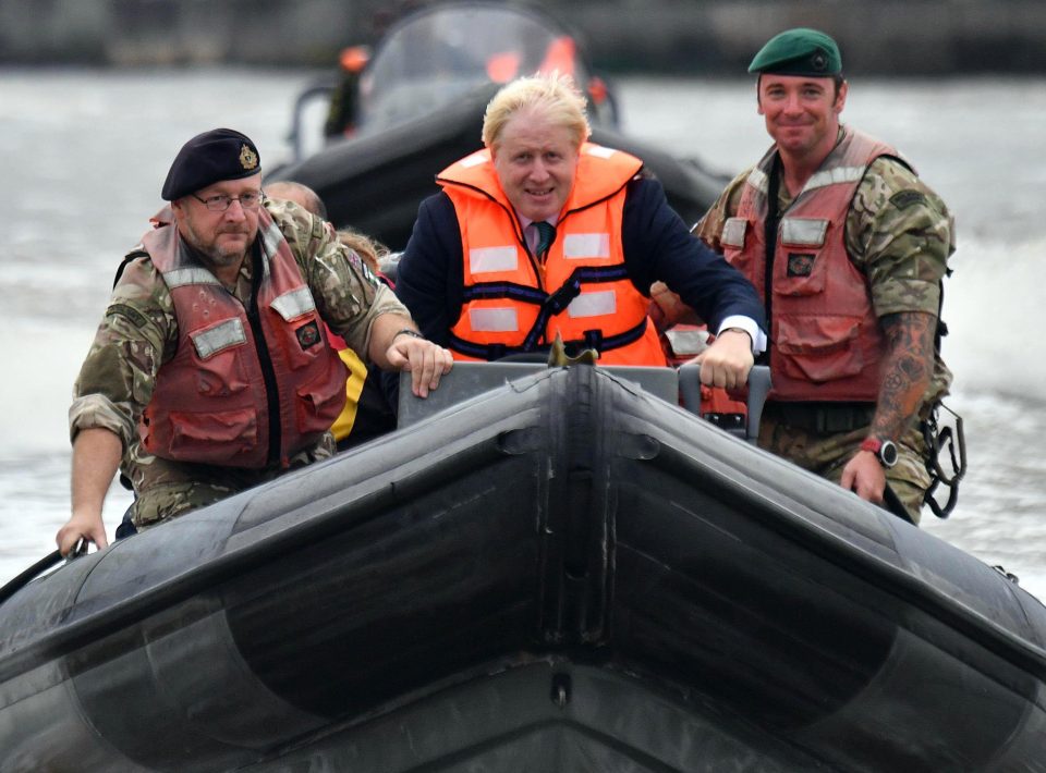  Boris Johnson on a boat during a trip to the Nigerian navy today