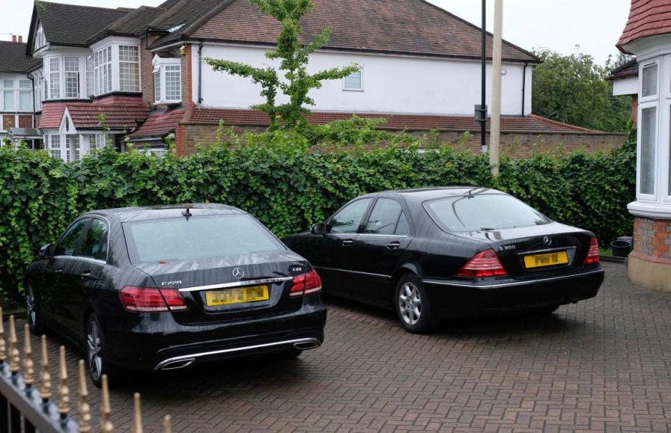  Two diplomatic Mercedes parked outside the property