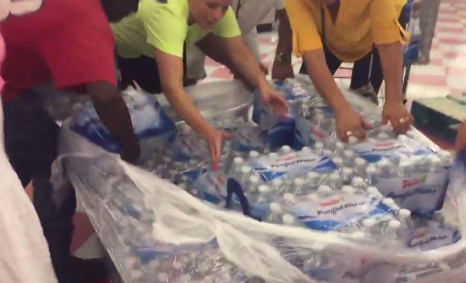  Shoppers were filmed grabbing water from stores as they rush to build up their supplies