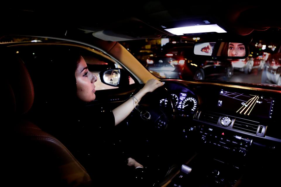  A woman drives her vehicle down Tahlia Street - one of busiest roads in Riyadh - after the ban ended