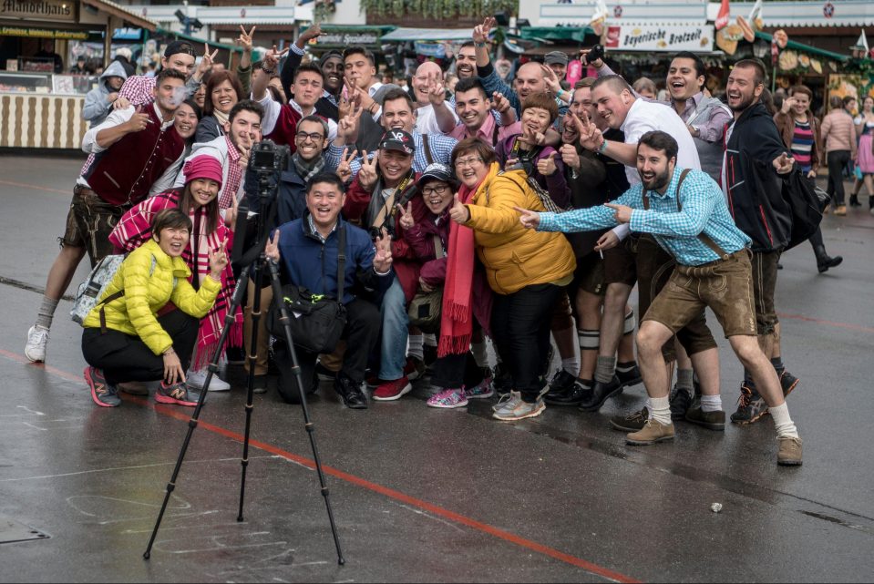  Tourists from across the world pose for photographs during the opening of the festival in the German Bavaria's state capital city of Munich, Germany