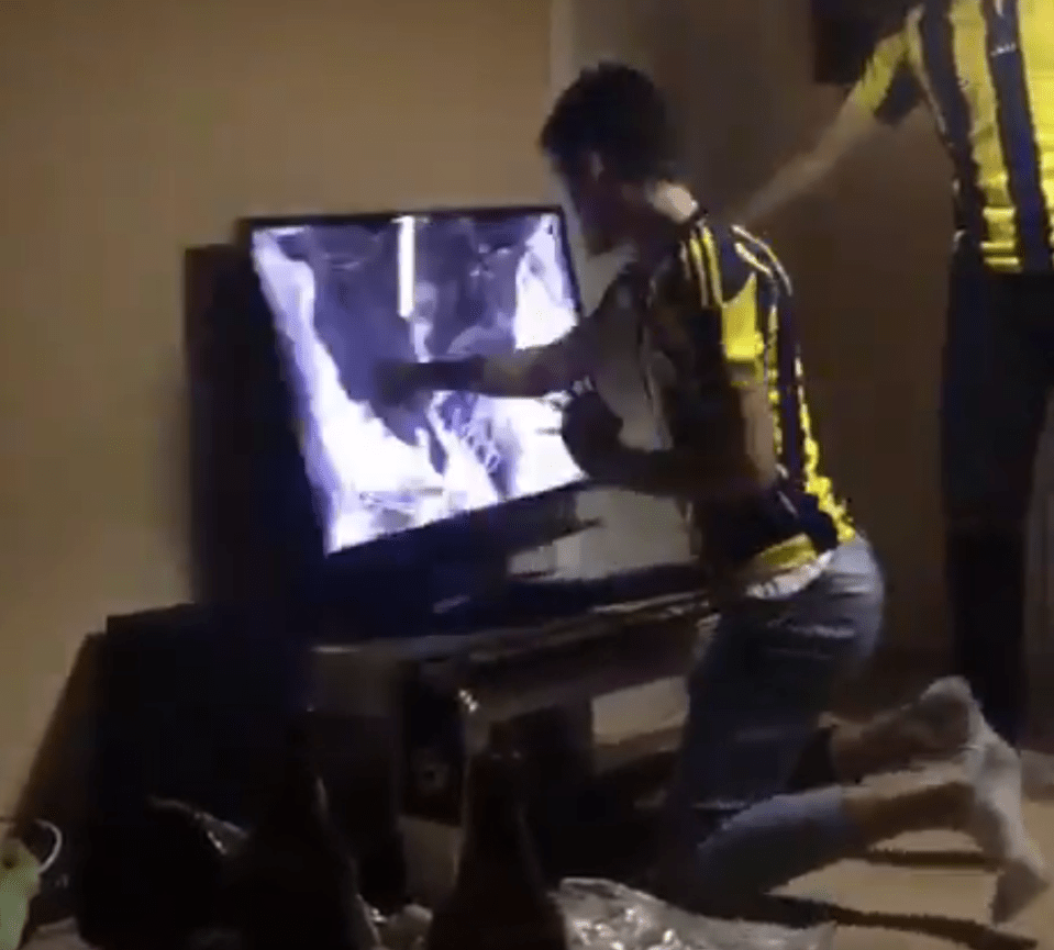  Angry Fenerbahce fan took his rage out on the helpless TV screen