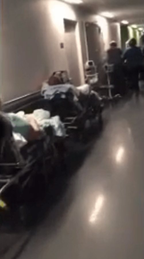  Shocking footage shows dozens of patients lined up a hospital corridor