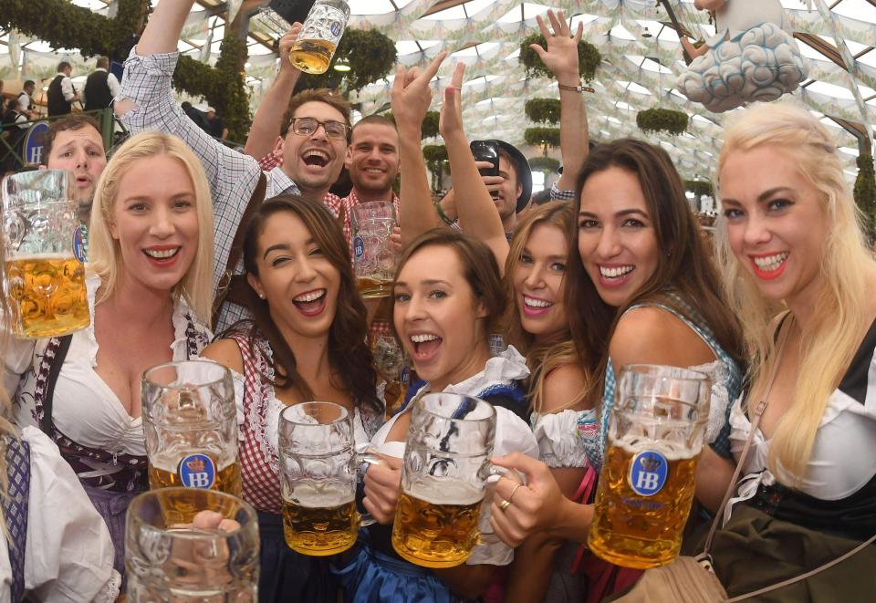  Girls let their hair down and enjoy the first mugs of beer at the world's largest beer festival