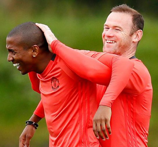  Ashley Young and Wayne Rooney fool about when they were Manchester United team-mates