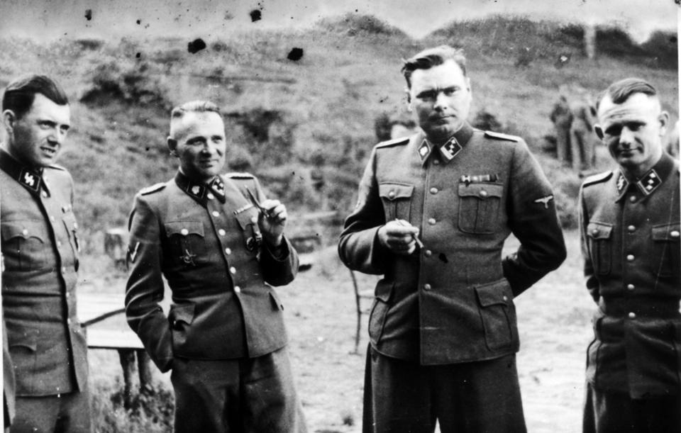  Dr Mengele, left, was evil incarnate, pictured here alongside Rudolf Hoss, second left, and Josef Kramer, second right