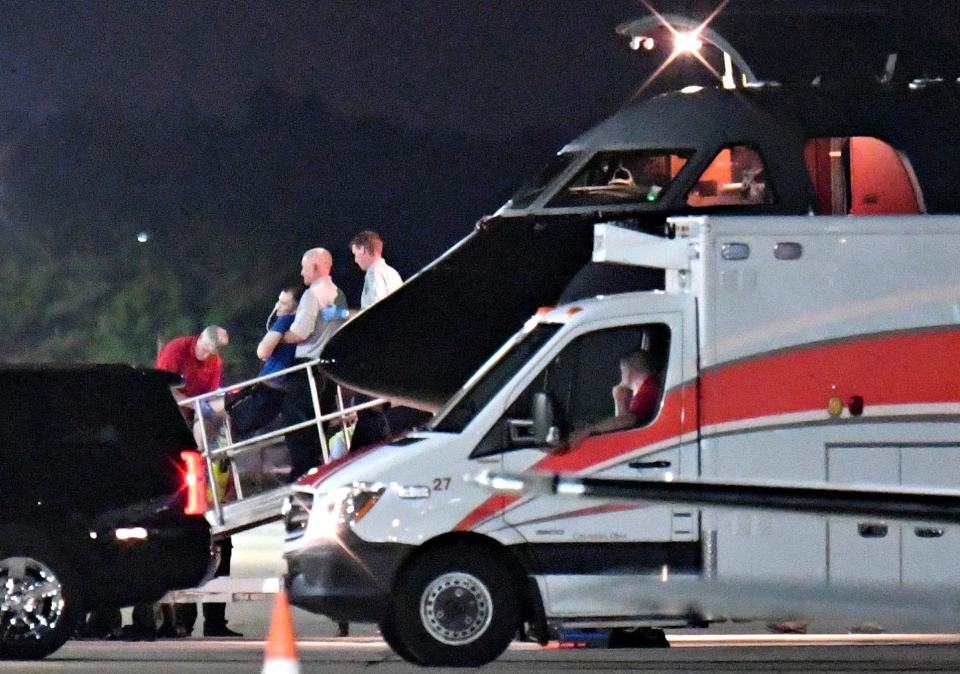  Otto Warmbier is transferred from a medical transport plane to a waiting ambulance at Lunken Airport in Cincinnati, Ohio, in June