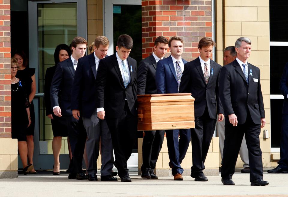  Friends and family carry his coffin during a funeral service held in the US in June