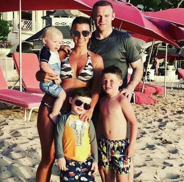 Rooney pictured with wife Coleen and sons Kit, Klay and Kai