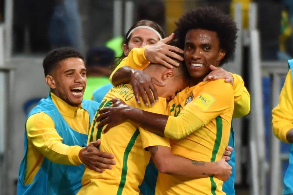  Philippe Coutinho was hugged by Brazil team-mates after his goal