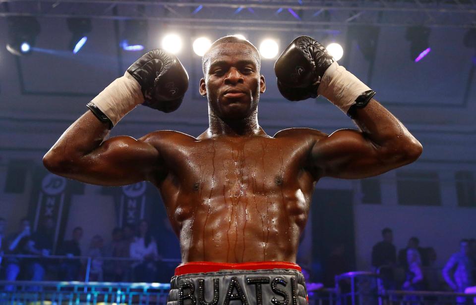  The 24-year-old celebrates after his knockout victory against his French opponent