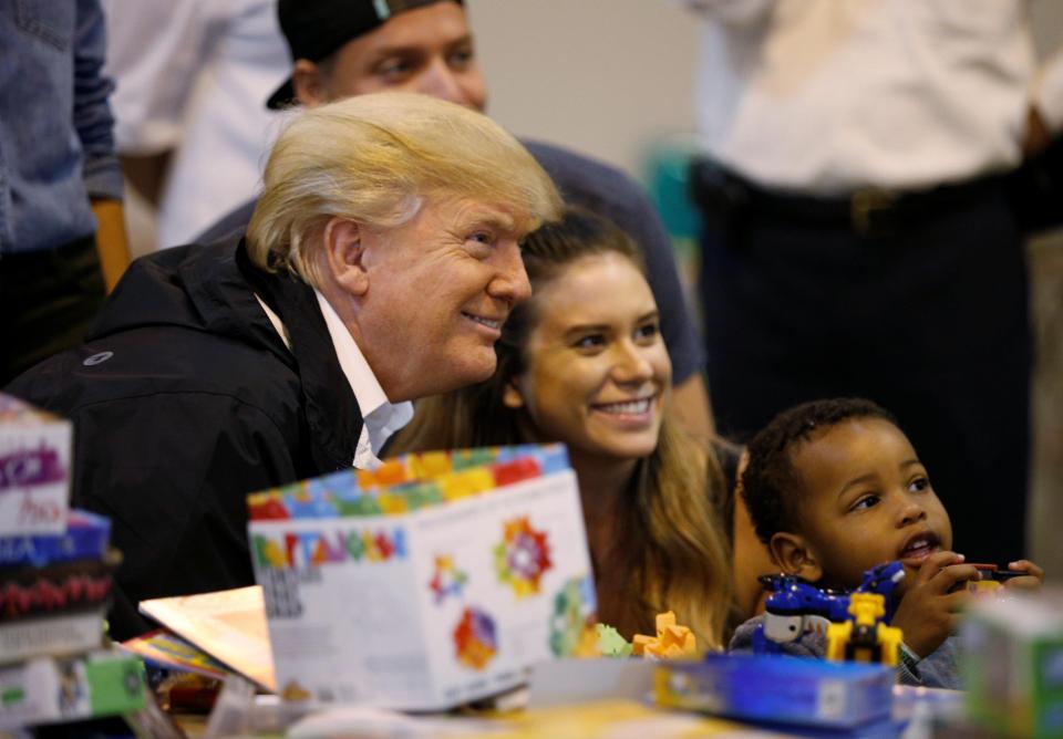  Trump visits with survivors of Hurricane Harvey at a relief center in Houston