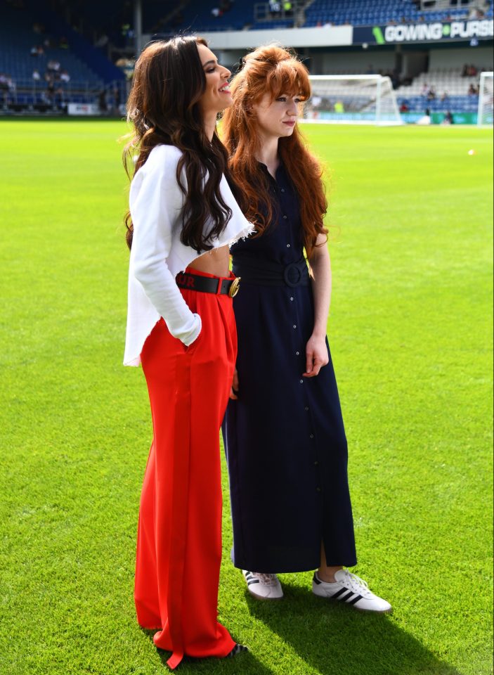  She looked happy and relaxed as she posed for pictures with her bandmate Nicola Roberts