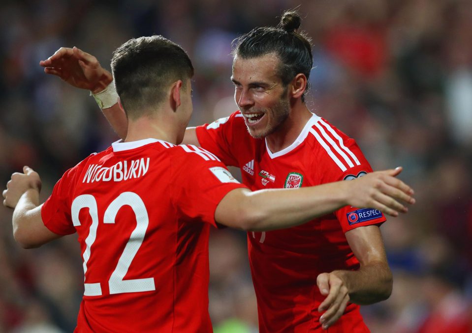  Gareth Bale celebrates Ben Woodburn's long-range winner against Austria