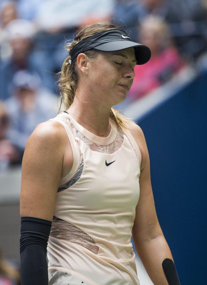  Maria Sharapova has crashed out of the US Open after losing in three sets