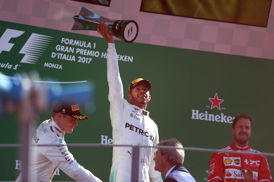 Lewis Hamilton raced to victory to win the Monza GP and go top of the standings