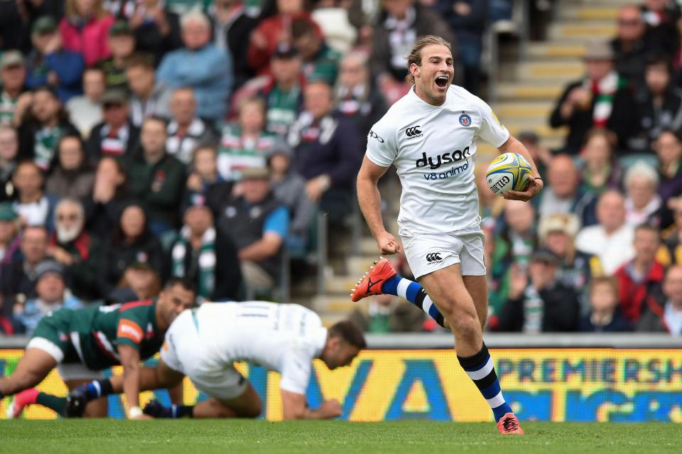  Max Clark is all smiles as he breaks through a tackle to score a try in Bath's first win at Welford Road since 2003