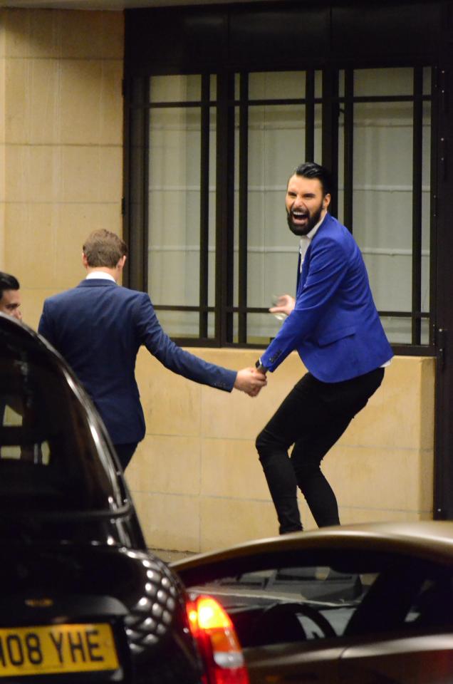  Rylan was pictured with a glass of wine in his hand outside the hotel