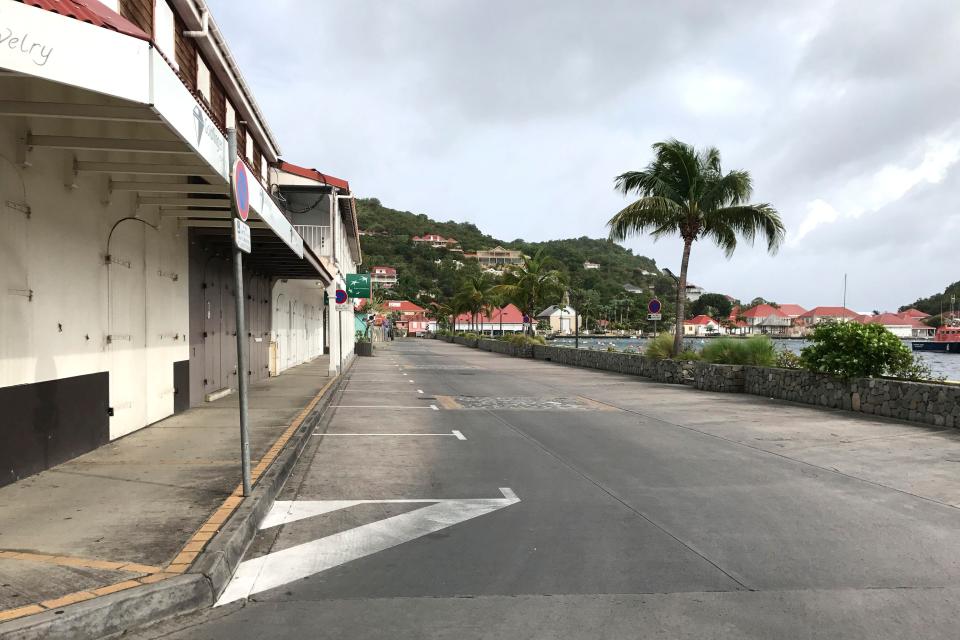  Streets - such as this one in the West Indies - were left deserted amid warnings to stay indoors