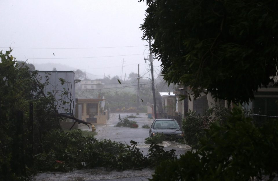  A street is flooded during Hurricane Imra in Fajardo, Puerto Rico