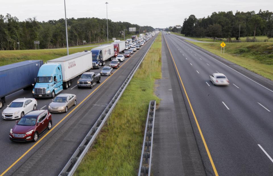  Florida residents have been urged to flee as Hurricane Irma approaches, pictured is evacuating traffic with one car going towards the storm