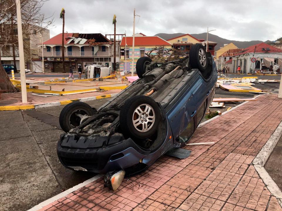  A car was left upside down amid the devastation as Hurricane Irma smashed in St Martin