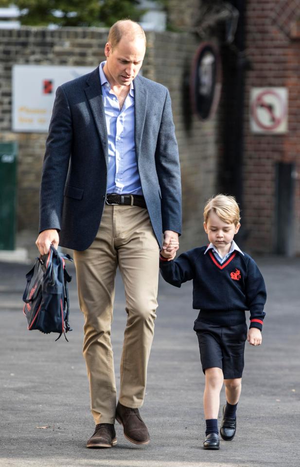  Prince William carried his son's backpack and held his hand for the big moment