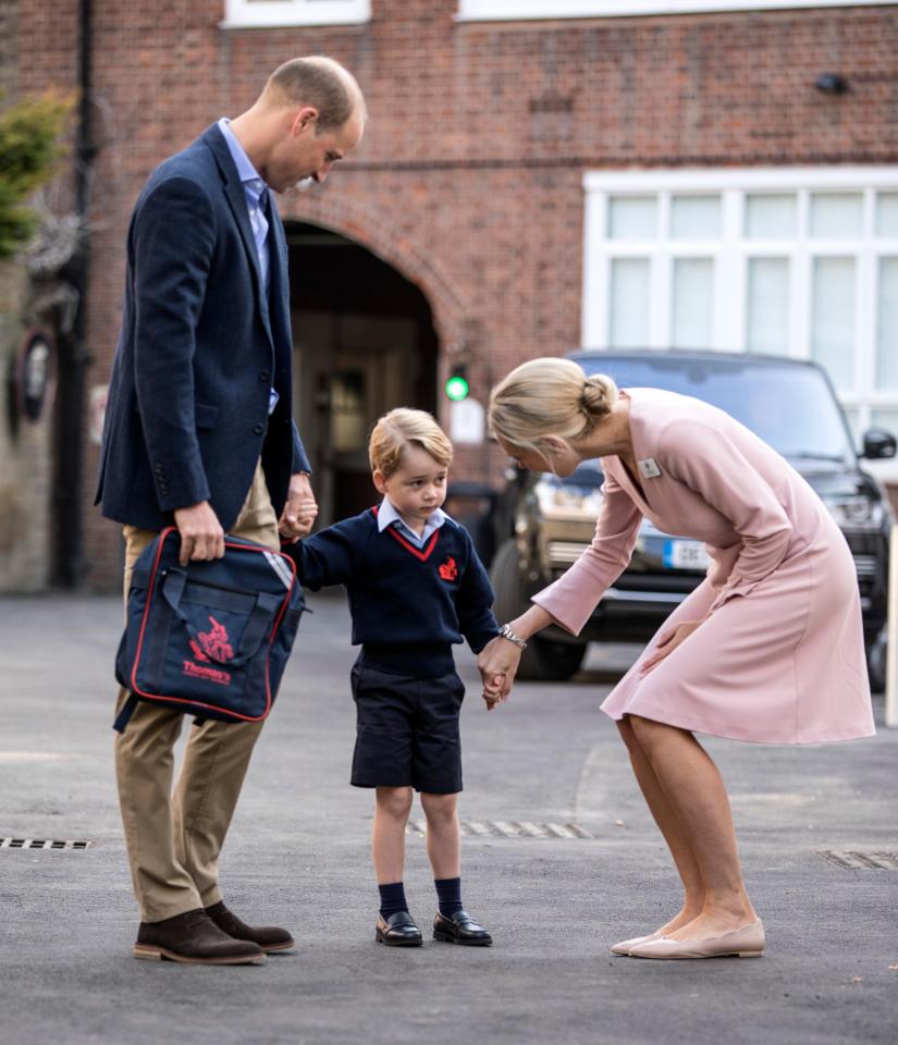  Four-year-old George looked apprehensive as he was greeted by Helen Haslem, head of the lower school