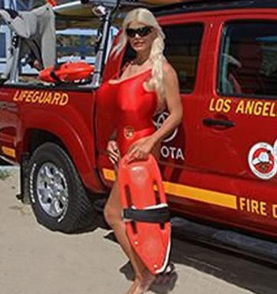  Martina channels Baywatch babe Pamela Anderson as she poses in an iconic red swimsuit