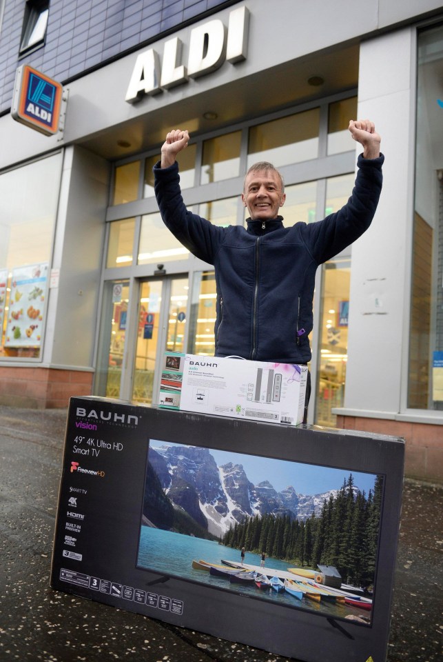 Douglas Black, 57, from Possil, Glasgow, Scotland, queued at 730am to get a special offer TV at Aldi on Glasgow High Street