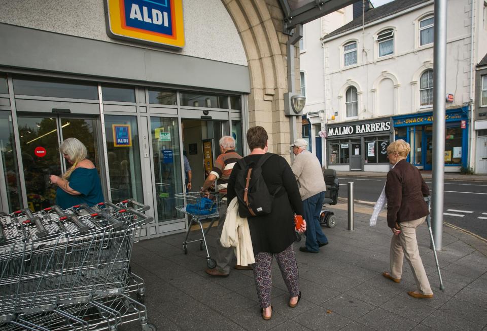  Aldi customers queue up outside its Plymouth branch