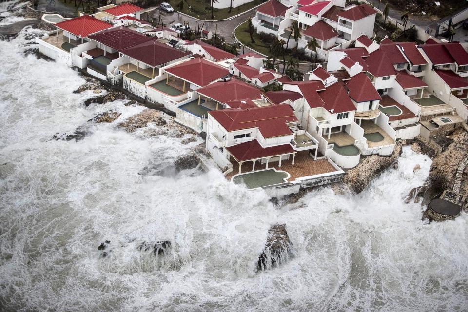  Huge waves smash against holiday homes on the Caribbean island of St Maarten