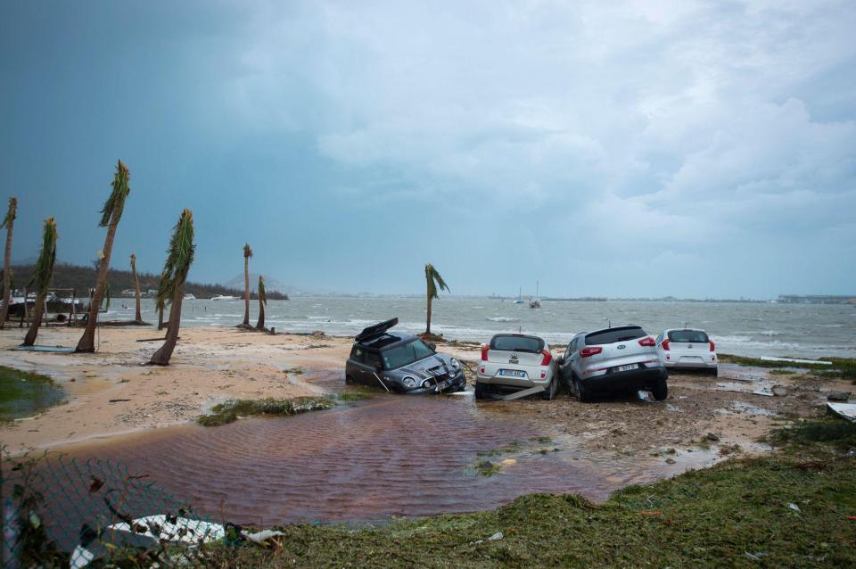  Four vehicles partially submerged at a beach in Marigot following the devastating storm