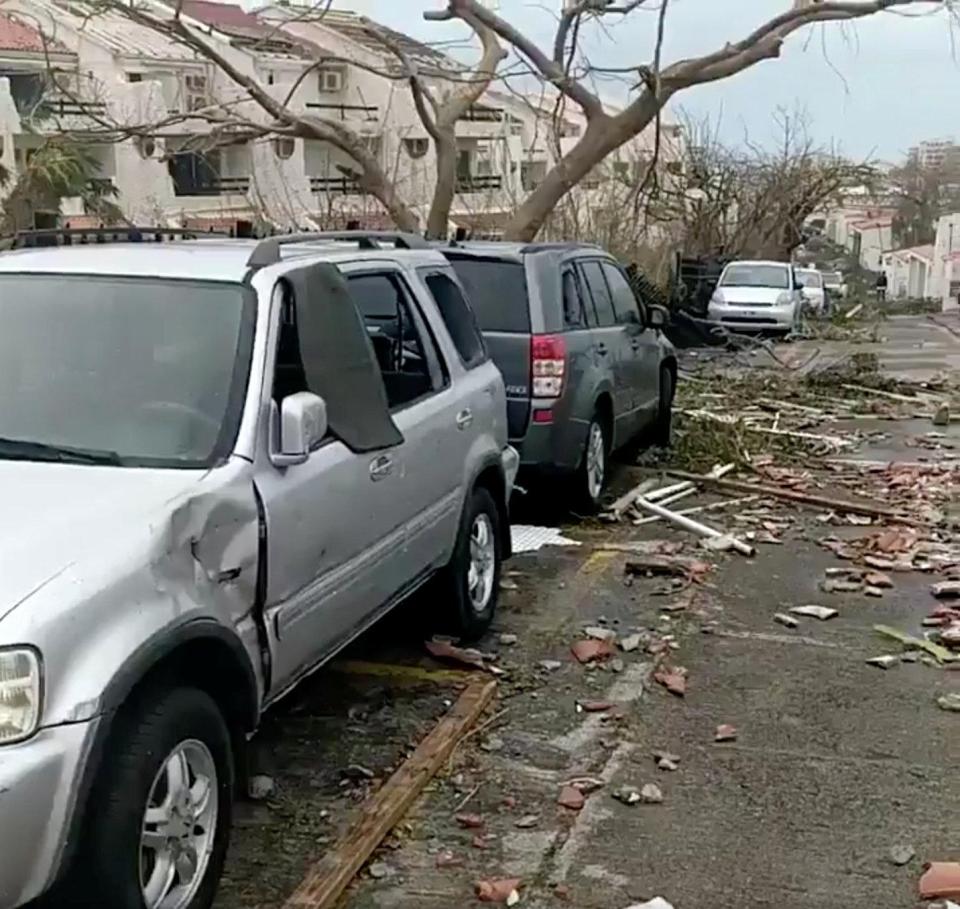  Debris scattered across a street in the Caribbean island