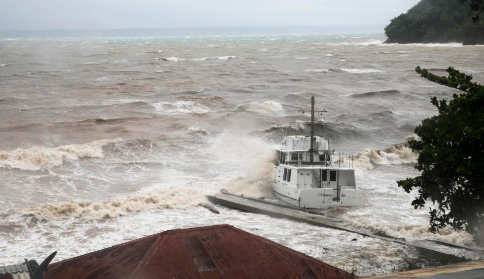  Waves crash against a boat near the shore as Hurricane Irma passes over Samana, Dominican Republic