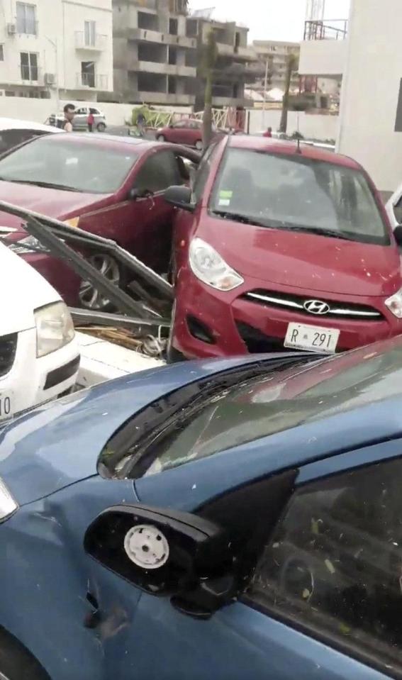  The vehicles left in a car park didn't stand a chance against the powerful hurricane